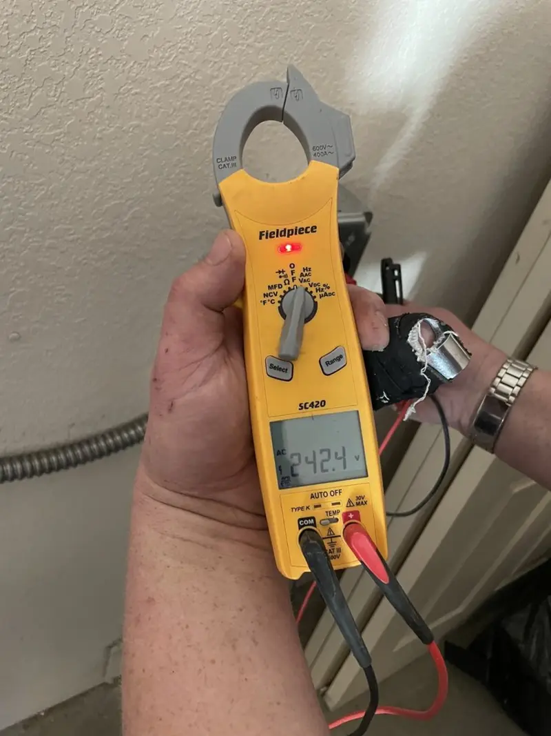Voltage testing with clamp meter during Outlet Installation in Rockwood